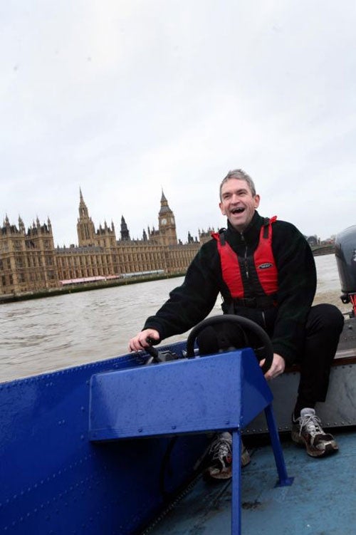 Richard Sharp fulfills his favourtie James Bond fantasy in a 50-year-old blue speedboat  © Teri Pengilley