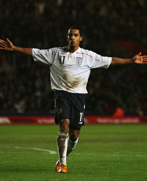 Walcott celebrates scoring England Under-21s' third goal against the Republic of Ireland