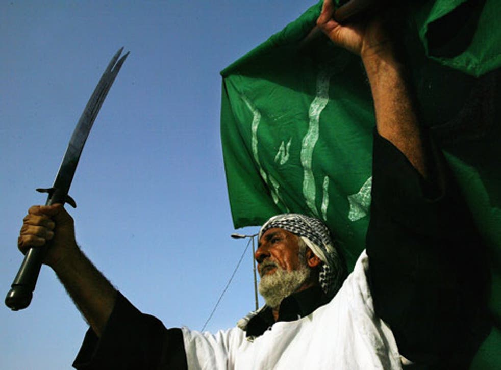A man takes part in a ceremony celebrating the establishment of Muqtada al-Sadr's Mehdi Army