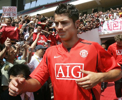 Cristiano Ronaldo gets a taste of things to come as he runs out to train with Man United in Guangzhou, China
