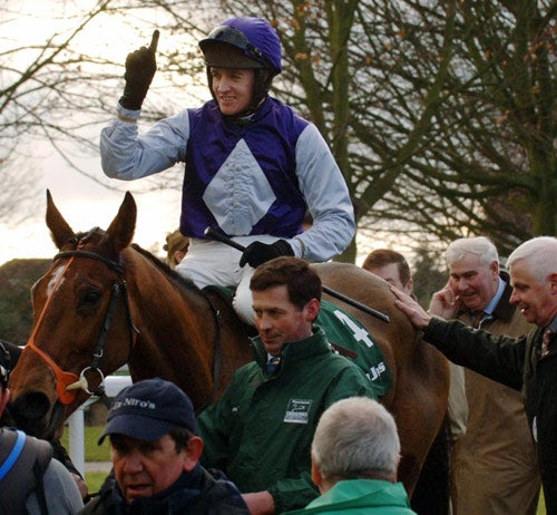Kicking King and Barry Geraghty take the crowd's acclaim after their second victory in the King George