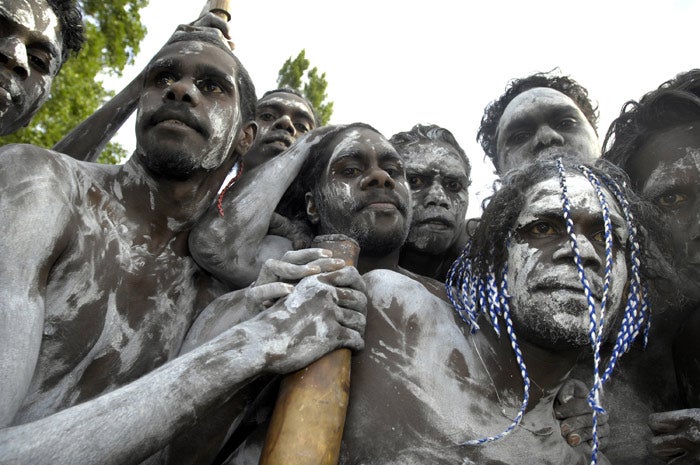 Aborigines watch the Ngunnawal ceremony at the opening of parliament in Canberra yesterday