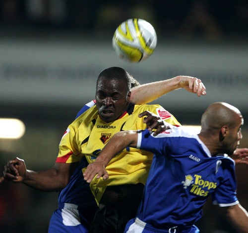 Danny Shittu battles with Leicester's defence at Vicarage Road