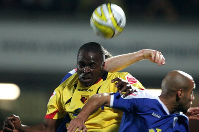 Danny Shittu battles with Leicester's defence at Vicarage Road