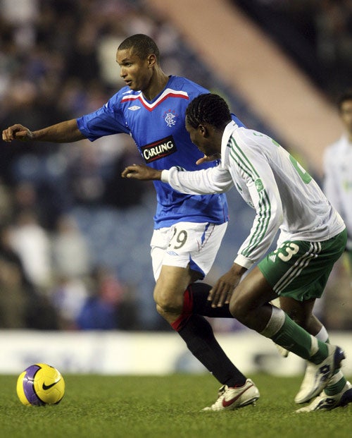 Rangers' Daniel Cousin (left) vies for the ball with Panathinaikos' Mate Simao