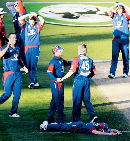 Paul Collingwood lies on the ground after just failing to run out Kyle Mills and steal victory for England in the tied fourth one-day international in Napier © Reuters