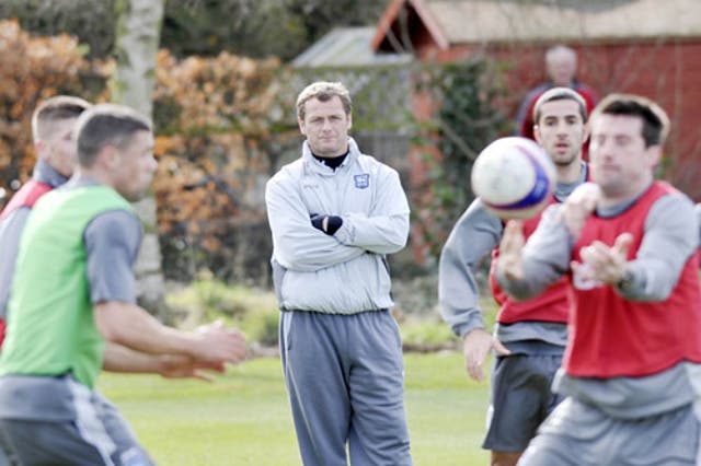 Magilton supervises an Ipswich training session yesterday. 'I said on the first day I wasn't going to mollycoddle anybody, but if they gave me everything, I would respond in kind,' he says