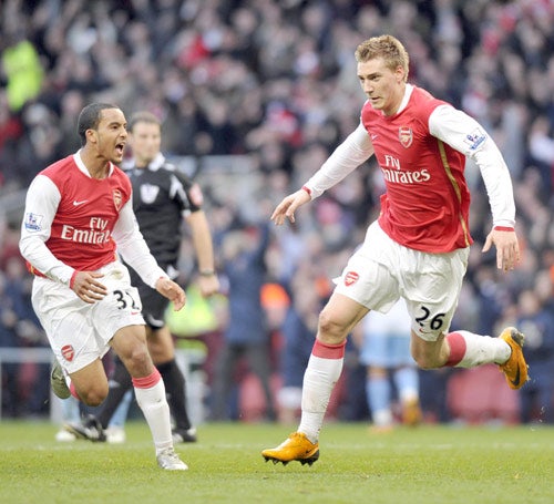 Theo Walcott screams with delight as the Arsenal goalscorer Nicklas Bendtner celebrates his late equaliser