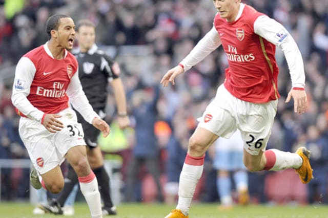 Theo Walcott screams with delight as the Arsenal goalscorer Nicklas Bendtner celebrates his late equaliser