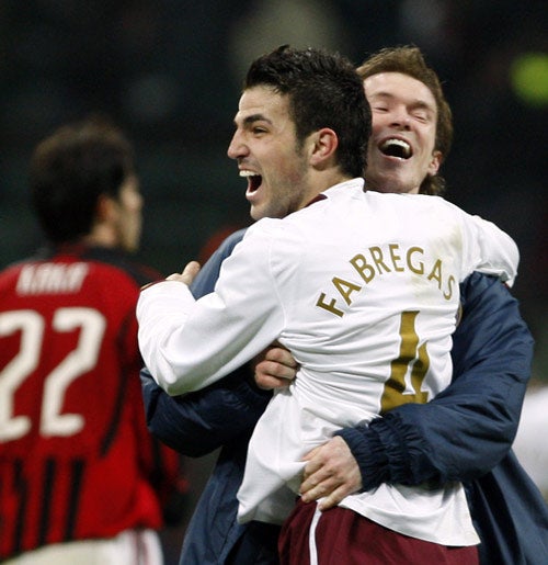 Alexander Hleb embraces Cesc Fabregas after his virtuoso display in Milan. Both are pivotalmidfielders in what is clearly more of a team and less 10 players supporting Thierry Henry