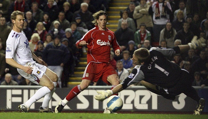 Torres scores his and Liverpool's third goal in their 4-0 drubbing of West Ham at Anfield last night