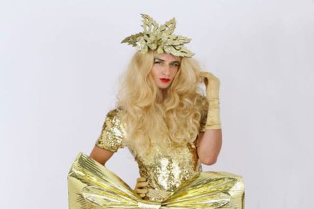 Big glitter lips, giant eyelashes andblonde wigs make up Russella's 'Dynasty glam' look © Abbie Trayler-Smith