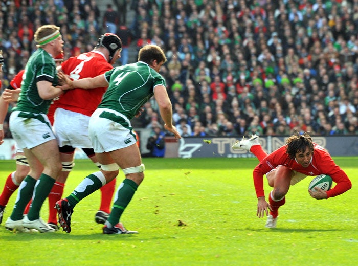 Gavin Henson (right) is off to a flier during an excellent victory for the Welsh at Croke Park to keep the Grand Slam dream alive