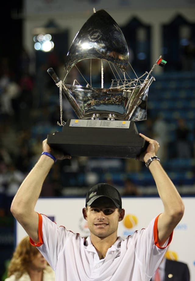 Roddick holds the trophy after defeating Feliciano Lopez of Spain in the final of the Dubai Tennis Championships