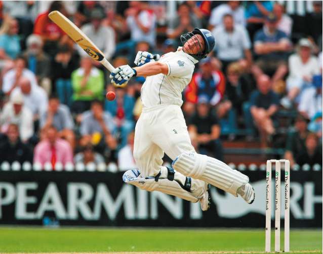 England's Tim Ambrose avoids a bouncer during his unbeaten innings of 97 on the first day