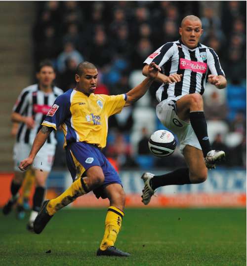 Leicester City's Patrick Kisnorbo looks to clear as West Bromwich Albion's Roman Bednar preparesto challenge during a stunning 4-1 victory for the Foxes