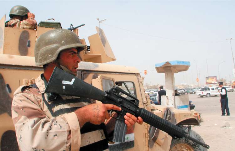Iraqi soldiers are fighting Shia militias for control of Basra