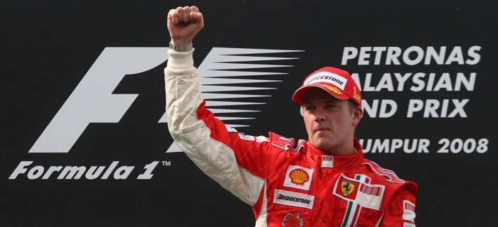 Kimi Raikkonen raises his hand on the podium after winning the Malaysian F1 Grand Prix © Reuters