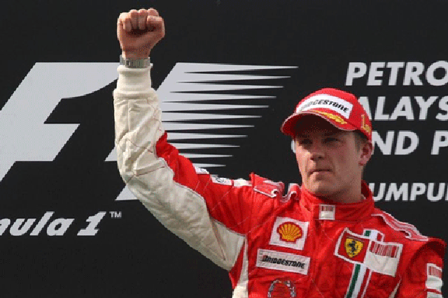 Kimi Raikkonen raises his hand on the podium after winning the Malaysian F1 Grand Prix © Reuters