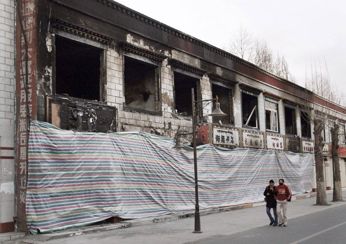 Observers were shown burnt-out shops belonging to ethnic Chinese that were attacked during the violent protests in Lhasa