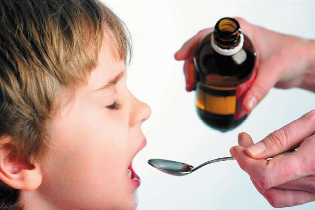 <p>A generic picture of a child being given cough syrup </p>