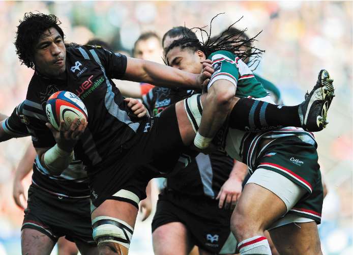 Leicester Tigers winger Alesana Tuilagi (right) gets to grips with the Ospreys No 8 Filo Tiatia