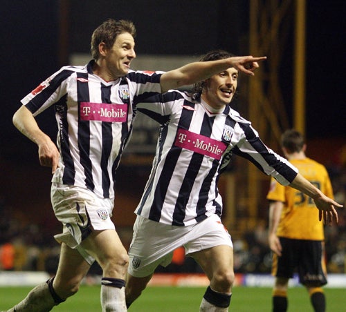 Zoltan Gera (left), West Bromwich's goalscorer, celebrates with Robert Koren during the 1-0 victory over Wolves at Molineux last night