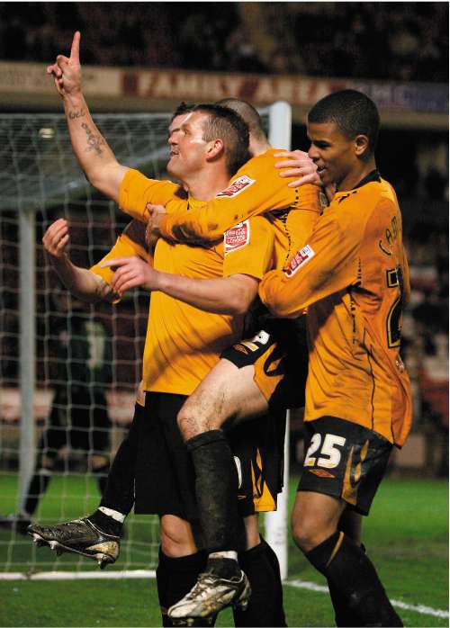 Substitute Dean Windass leads the celebrations after scoring Hull's third goal with his first touch