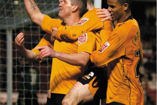 Substitute Dean Windass leads the celebrations after scoring Hull's third goal with his first touch