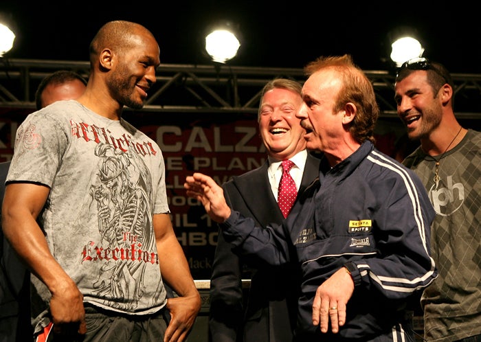 Bernard Hopkins appears somewhat bemused as Enzo Calzaghe, Joe's father and trainer, confronts him during the build-up totomorrow's light-heavyweight fight