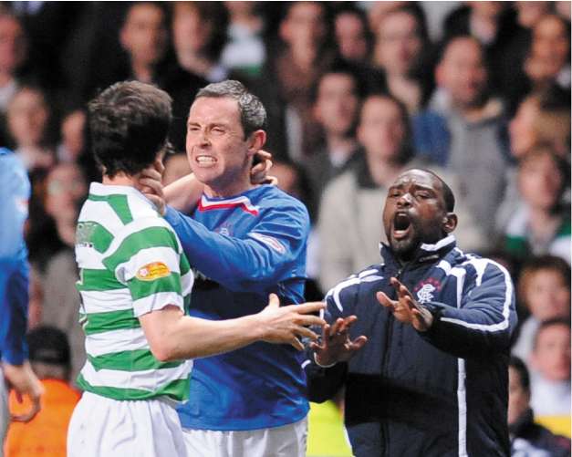 David Weir (centre) grapples with Celtic's Gary Caldwell at the end of the home side's 2-1 victory at Celtic Park. Both players were later given red cards by the referee
