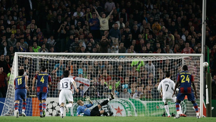 Ronaldo (No 7) puts his early penalty wide of Barcelona's goal at the Nou Camp