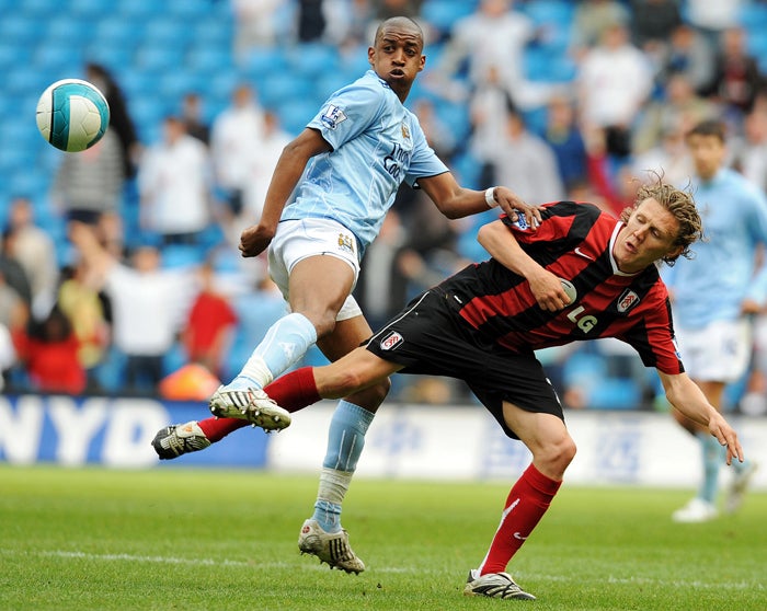 Gelson Fernandes (left) vies for the ball with Fulham midfielder Jimmy Bullard during an amazing victory for the Cottagers