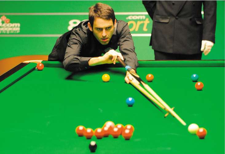 Ronnie O'Sullivan lines up a pot during his 13-7 victory over China's Liang Wenbo at the Crucible yesterday