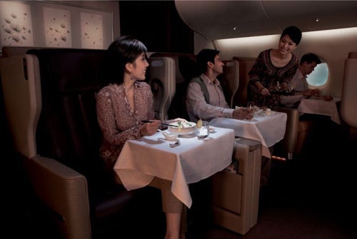 A file image of passengers enjoying their meal while flying with Singapore Airlines