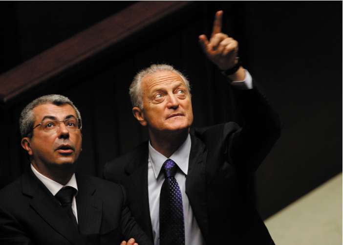 Center-right lawmaker Santo Versace (right), brother of the late Gianni, with a political colleague