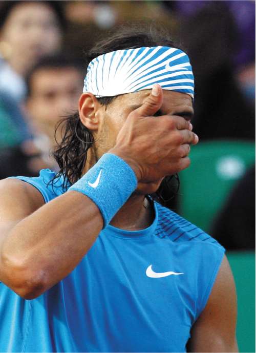 The pain of impending defeat tells for Rafael Nadal as he falls to Juan Carlos Ferrero in Rome yesterday