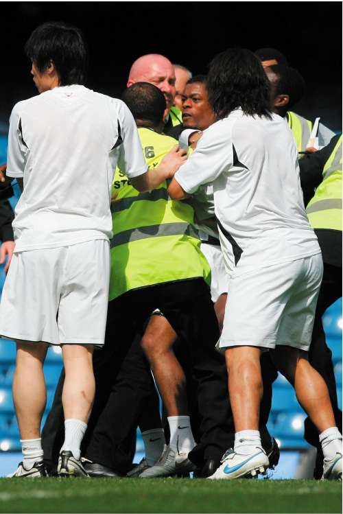 Manchester United's Patrice Evra at the centre of the melee that took place after his sides defeat at Chelsea