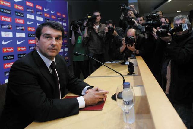 Barcelona's president Joan Laporta attends a press conference where he announced that reserve team coach and former midfielder Pep Guardiola would replace Frank Rijkaard as coach after a disappointing season