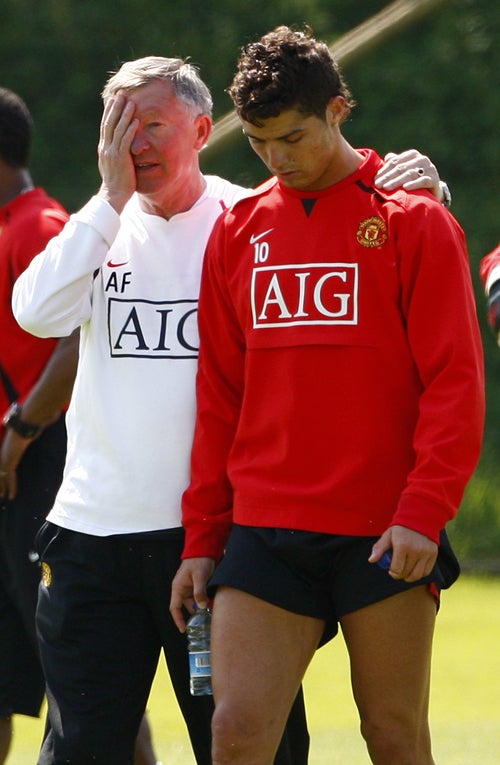 Sir Alex Ferguson, the Manchester United manager, with his star player during training yesterday