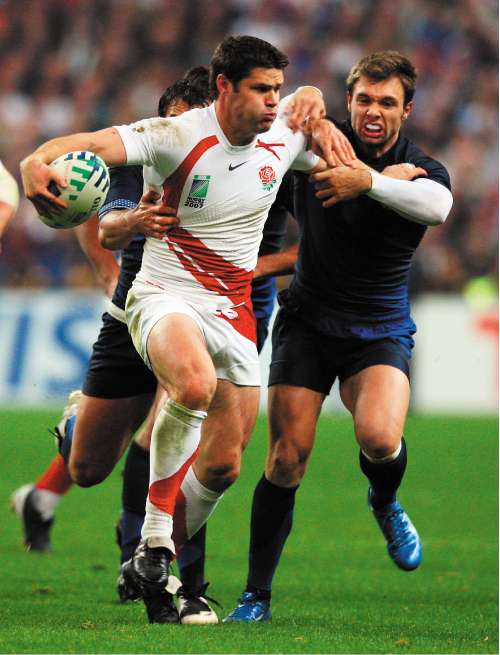 England centre Dan Hipkiss attempts to fend off the French defence during the World Cup semi-final at Stade de France in Paris last October