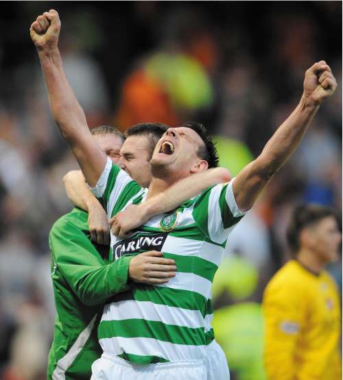 Jan Vennegoor of Hesselink celebrates scoring Celtic's winner as the club clinched their third successive title