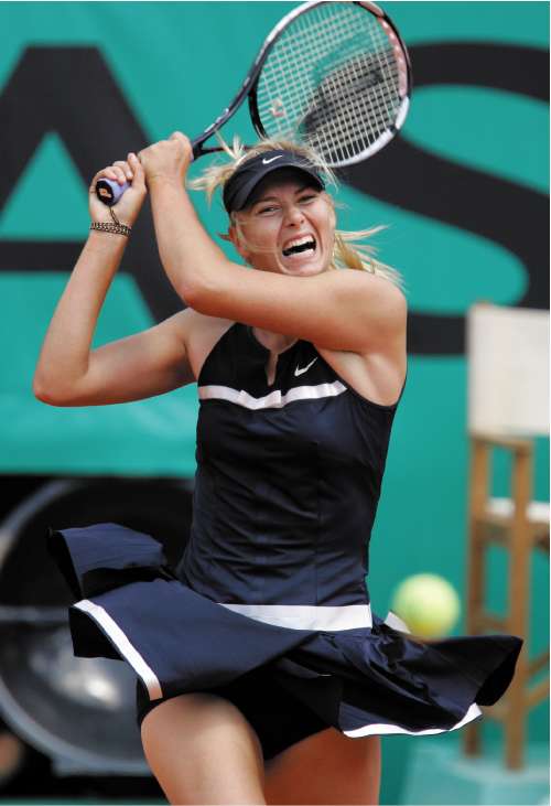 Maria Sharapova returns to fellow Russian Evgeniya Rodina, who came within two points of a famous victory in the first round in Paris yesterday