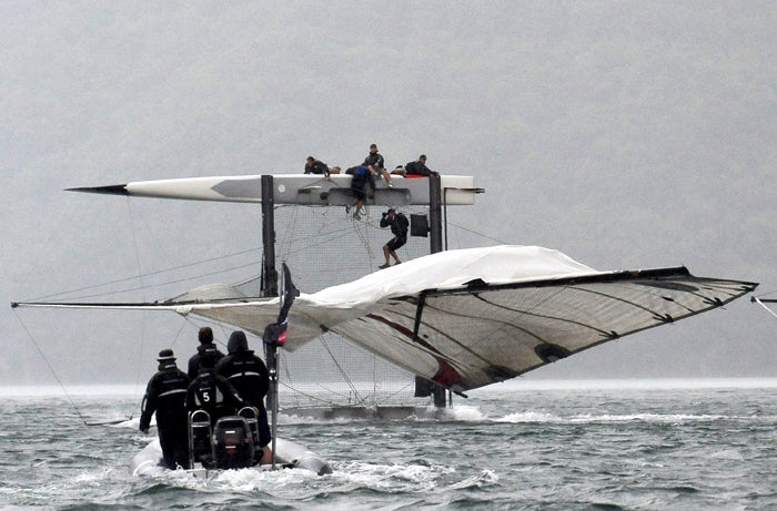 America's Cup winning helmsman Ed Baird flips the Alinghi Extreme 40 catamaran at the iShares Cup grand prix in Lugano
