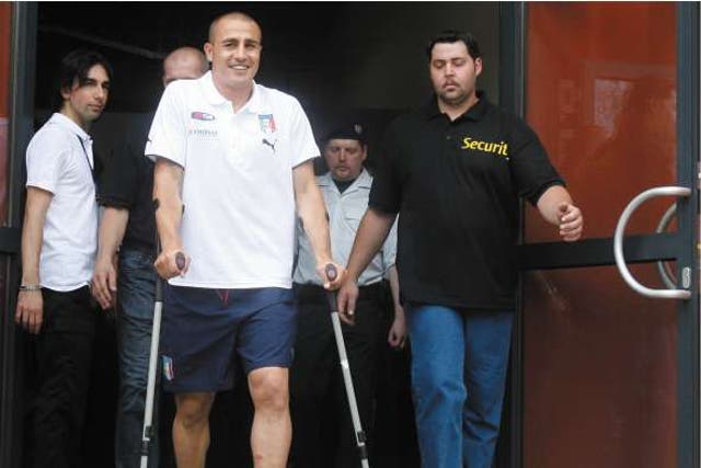 The Italy captain leaves the Azzurri headquarters on crutches after being ruled out of the European Championship with an ankle injury