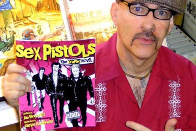 Comic artist Jim McCarthy with his book, Sex Pistols