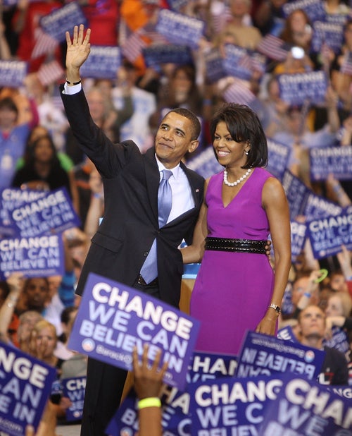 Barack Obama and his wife, Michelle,salute supporters in St Paul, Minnesota