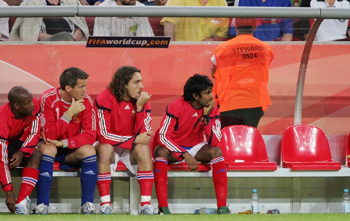 Dhorasoo (far right) watches France play Togo in Cologne from the bench