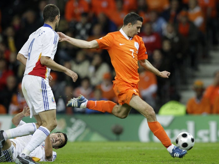 Robin van Persie surges past the Romanian defence to score the Netherlands' second goal