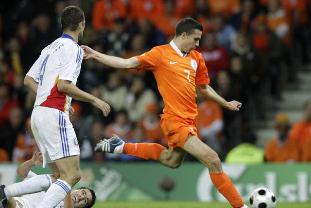 Robin van Persie surges past the Romanian defence to score the Netherlands' second goal